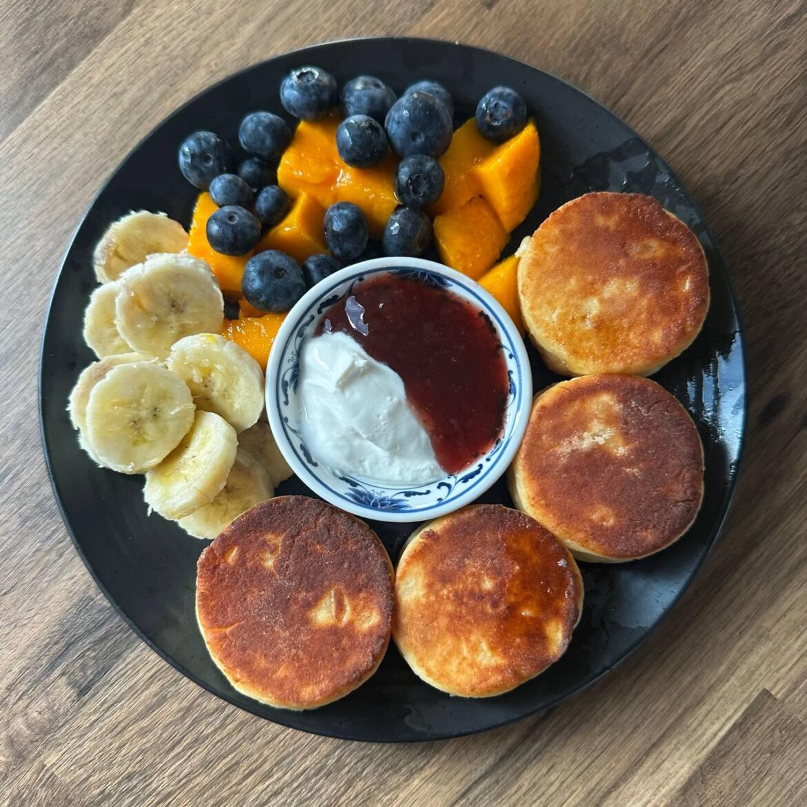 Cottage Cheese Pancakes with bananas, mango, blueberries.