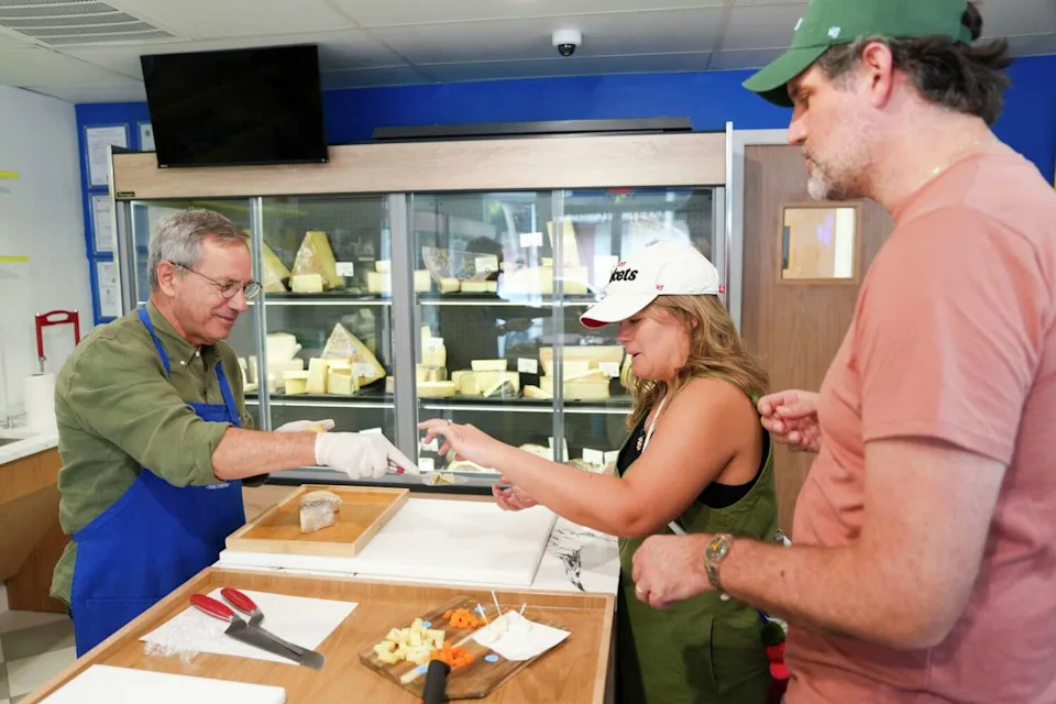 Owner Randolph Daniels-Kolin, left, helps Shelly Katz and her husband, Nat, learn and sample various cheeses at his new store A Cheese Affair in Rice Village in Houston, Friday, Sept. 26, 2025. (Jason Fochtman/Houston Chronicle)