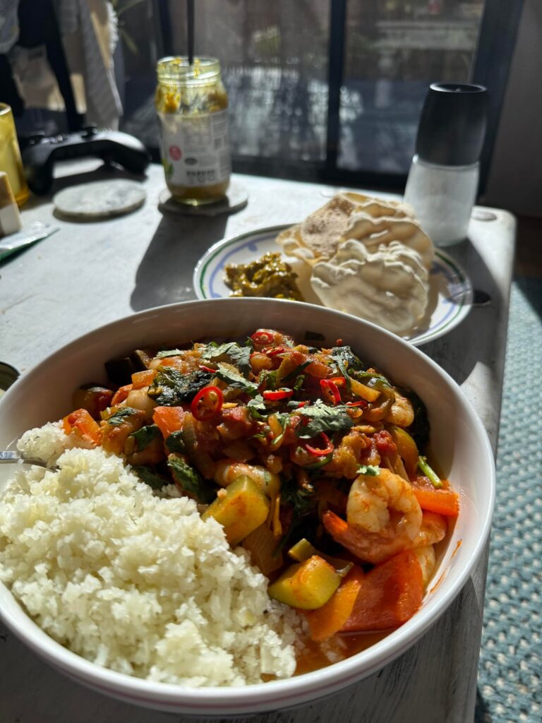 Prawn Curry with Cauliflower Rice, poppadoms and lime pickle…
