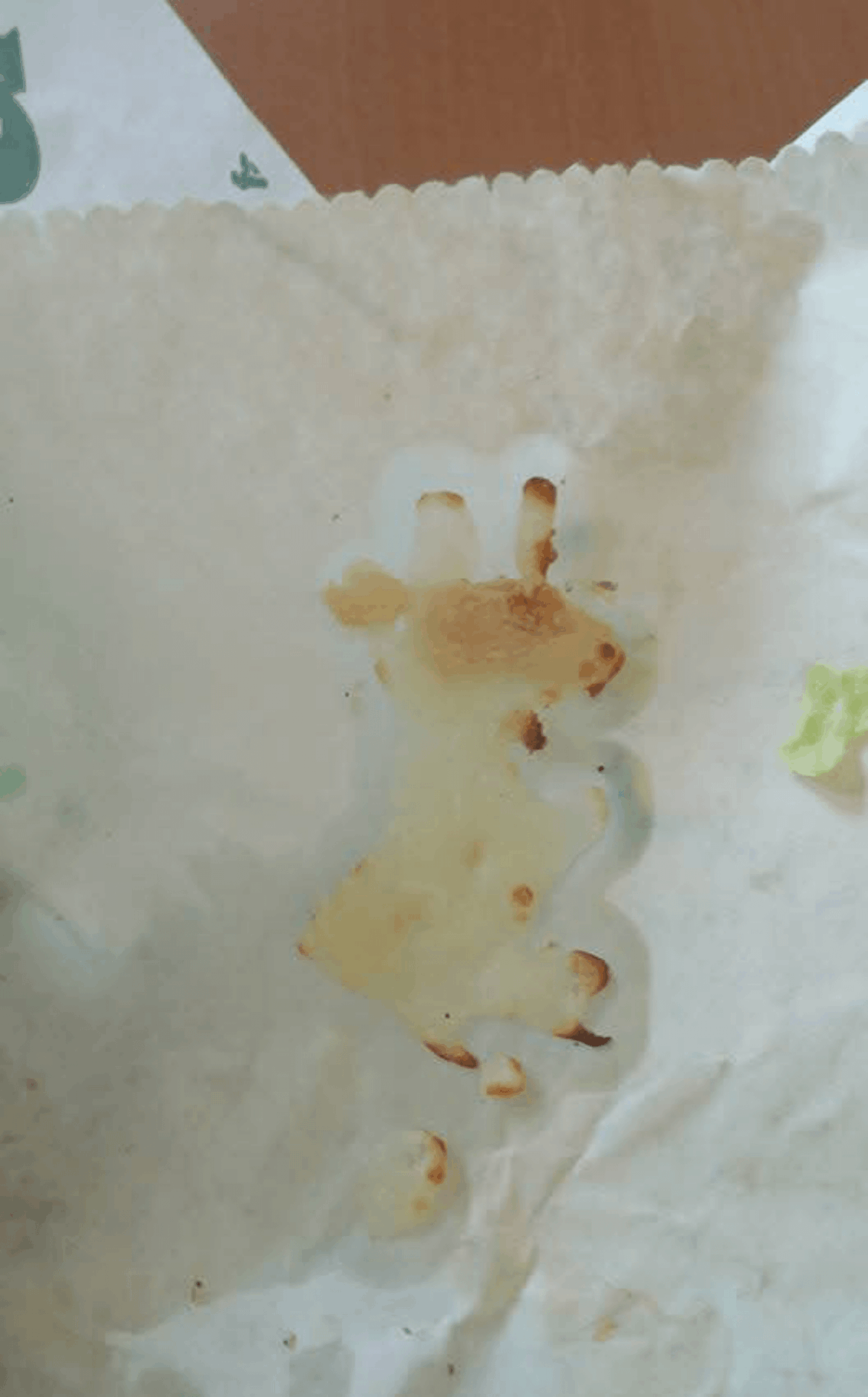 The cheese from my subway sandwich looks like a little giraffe