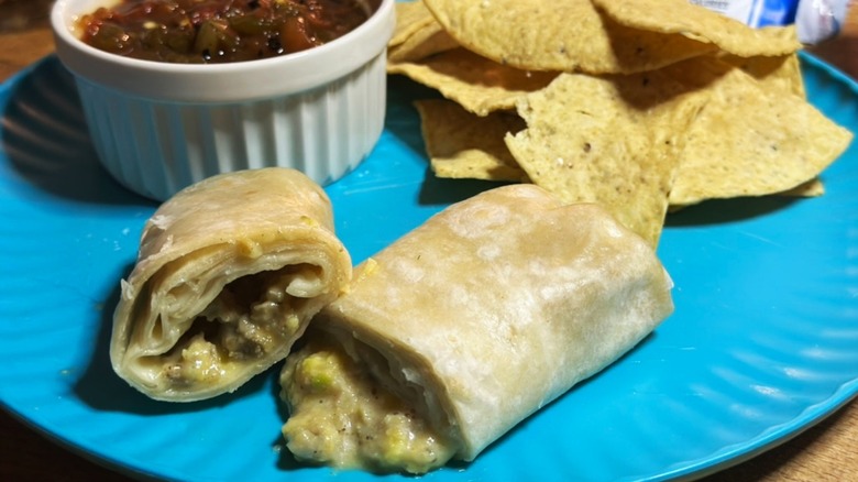 Red's Chicken Maple Sausage on blue plate with chips and salsa