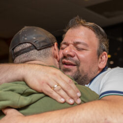 Dimitri hugs long-time patron Mathew Ein. This tableau repeated itself over and over throughout the final days of Park Plaza. Photo by Beth Eisgrau-Heller