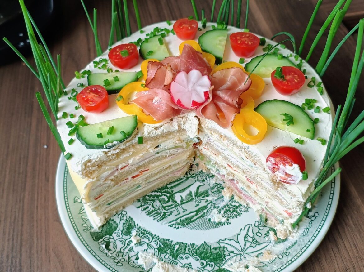 I don't like sweets so my girlfriend made this sandwich cake for my birthday. It's toast bread with ham and cheese and other stuff.