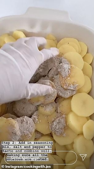 In a large baking dish, she seasoned the potatoes with the French onion soup mix, garlic powder and salt and pepper to taste