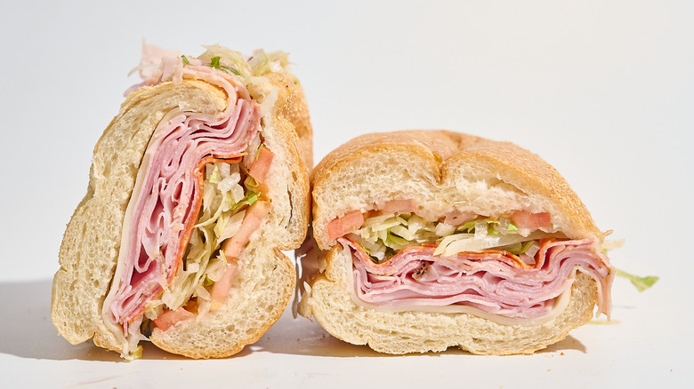 Jersey Mike's Original Italian sandwich sliced in half on a white table