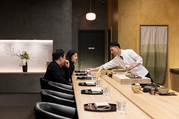Chef Tomotaka Ishizuka behind the counter of his Kaga kaiseki restaurant Tomo-An.
