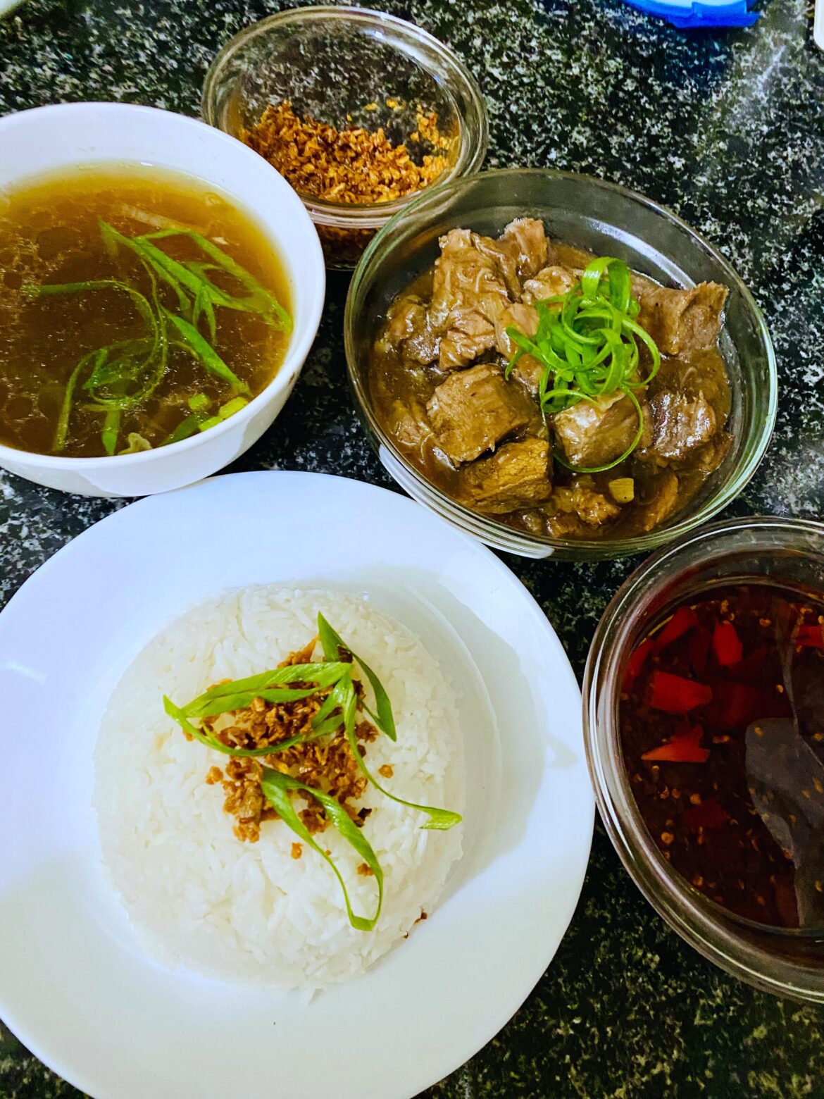 Beef pares! “Pares” means “pair” in Filipino, referring to the classic trio: braised beef, garlic fried rice, and a bowl of clear beef broth