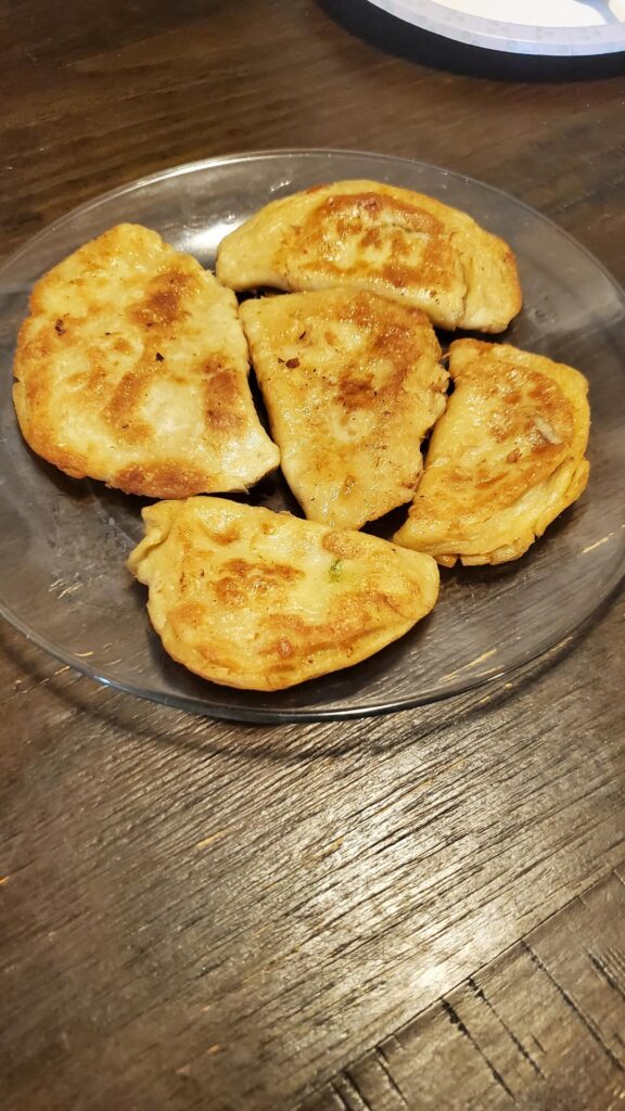 Onion and Cabbage Pierogis (to be topped with caramelized onions and sour cream)
