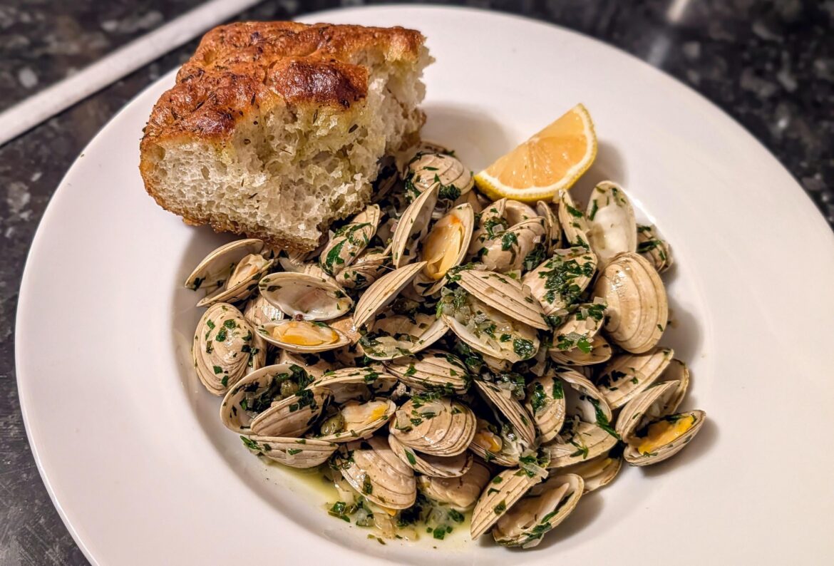 Clams with wild garlic, capers, parsley and homemade focaccia