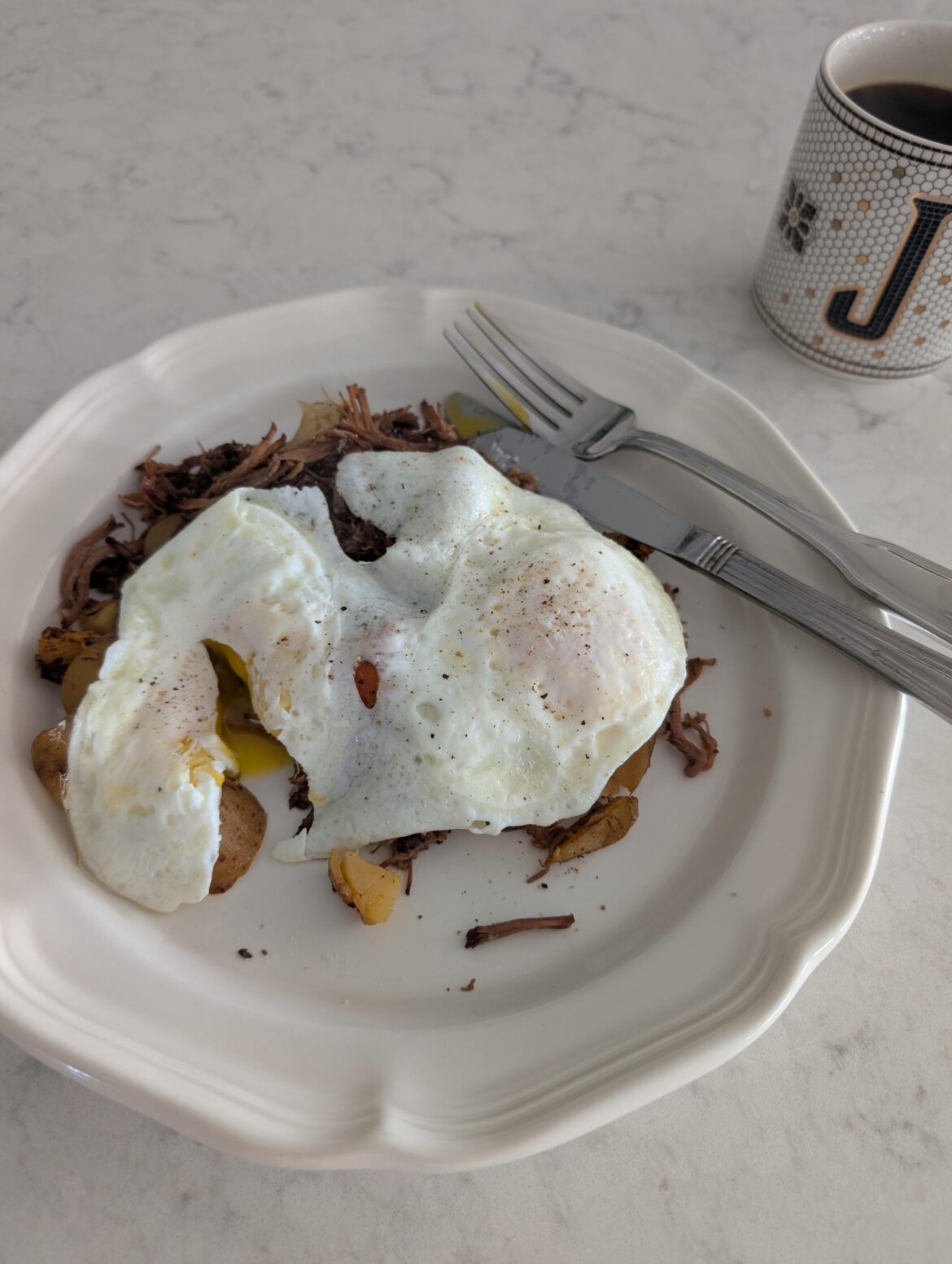 Pot roast hash with over medium eggs