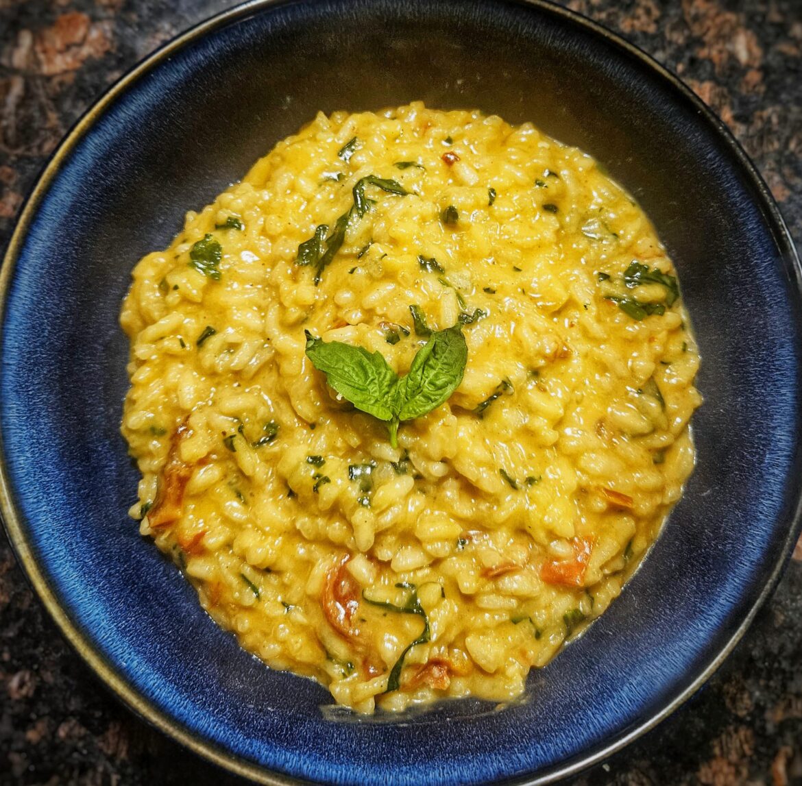 My wife's favorite for our 22nd anniversary. Risotto with saffron, sun-dried tomatoes, spinach, parmesan, and fresh basil.