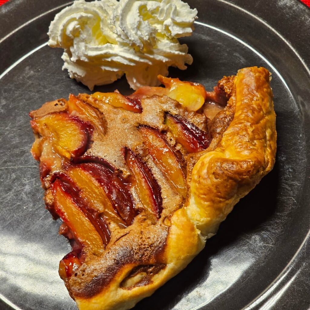 Typical Swiss Zwetschgenwähe — an open prume plum tart