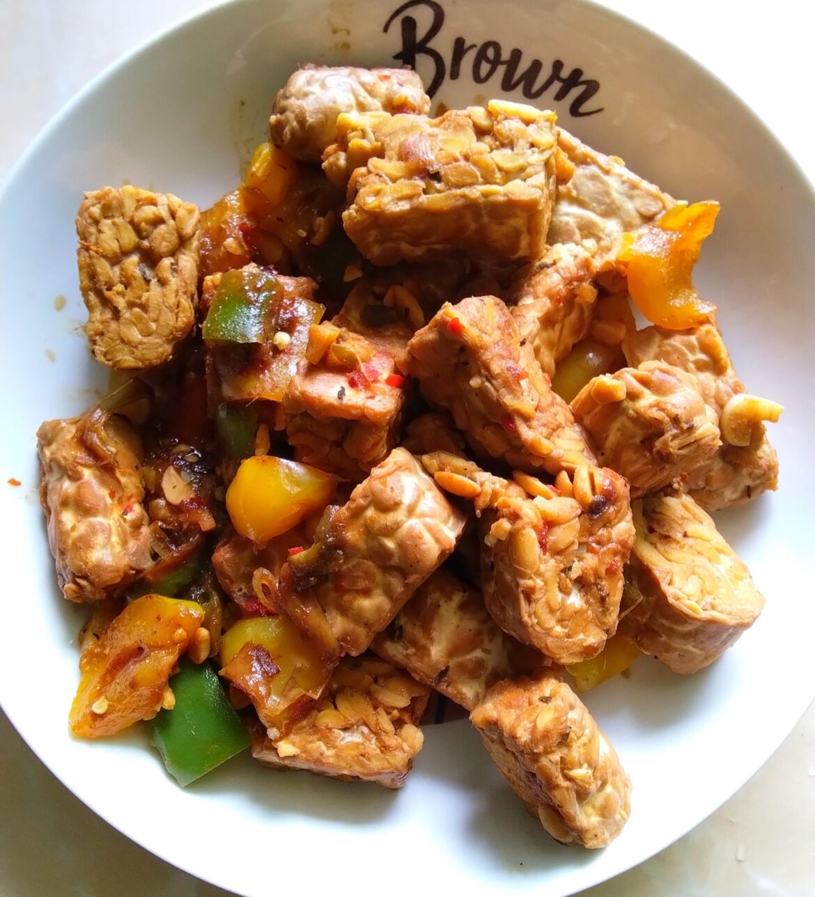 Marinated tempeh fried in sweet tangy sauce, with onions, garlics, bell peppers, spices & herbs