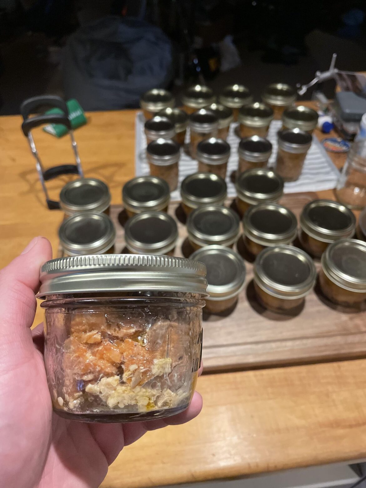 My cans of smoked salmon can be opened by prying the lid off with my hand. Is this telling of a failed batch of canning?