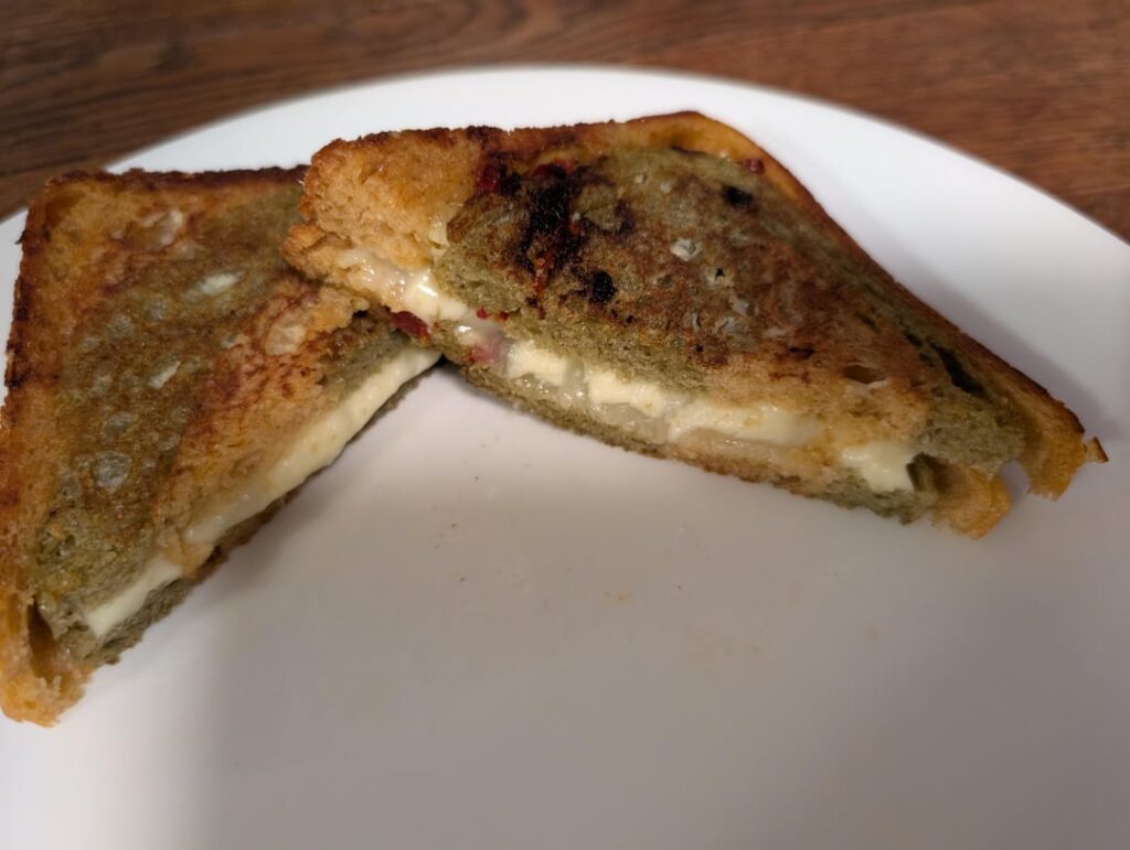 Did I successfully cheat the system, or am I banished? Spinach artichoke and tomato soup swirl bread with mozzarella provolone and Parmesan.
