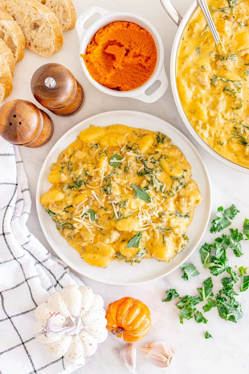 Creamy pumpkin sausage gnocchi on a plate.