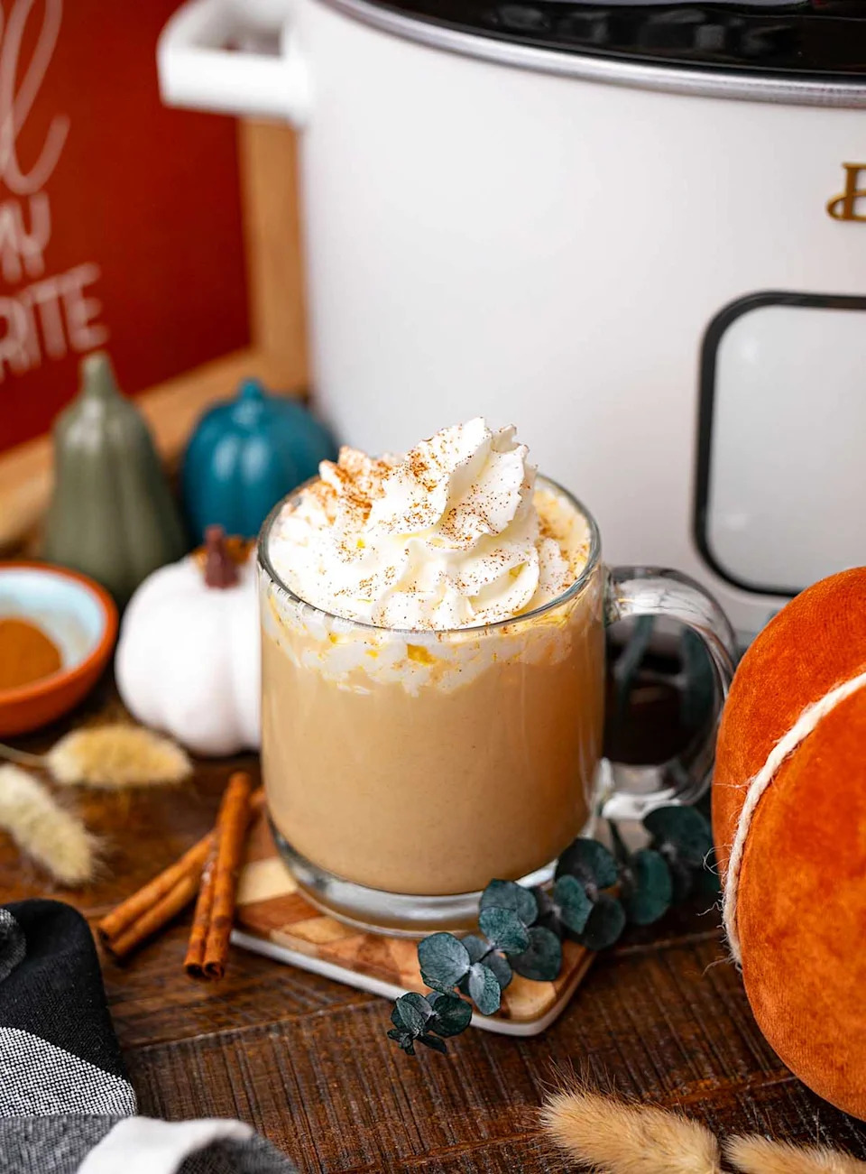 A close up shot slow cooker pumpkin spice latte.
