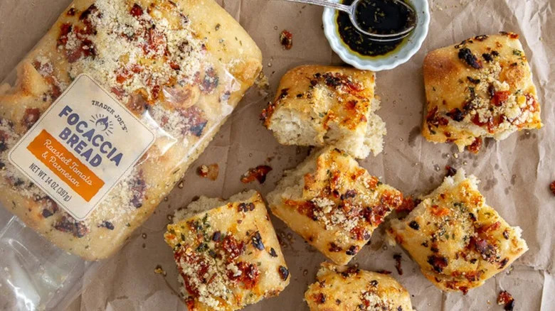 Loaf of Trader Joe's focaccia bread with roasted tomato & Parmesan torn into pieces