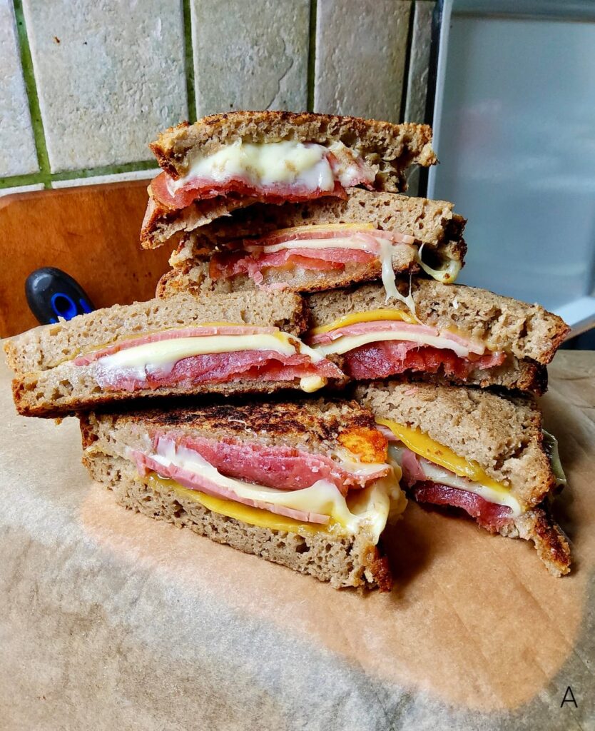 Sourdough rye sandwiches with cooked ham, hungarian salami, cheddar and gouda Sourdough rye sandwiches with cooked ham, hungarian salami, cheddar and gouda
