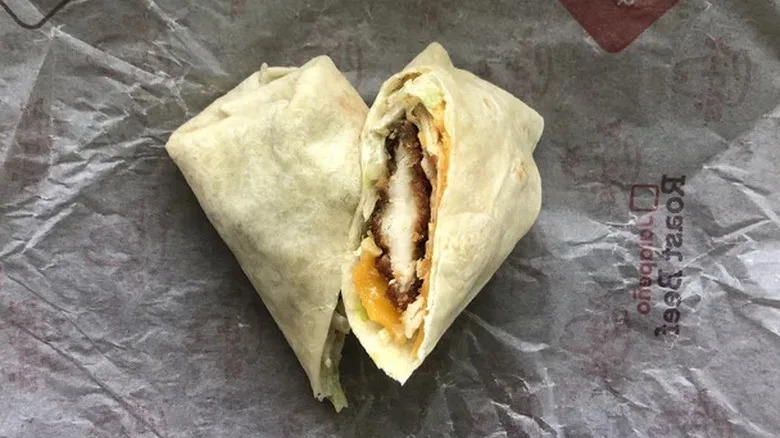 Arby's chicken ranch wrap sitting on top of wrapper