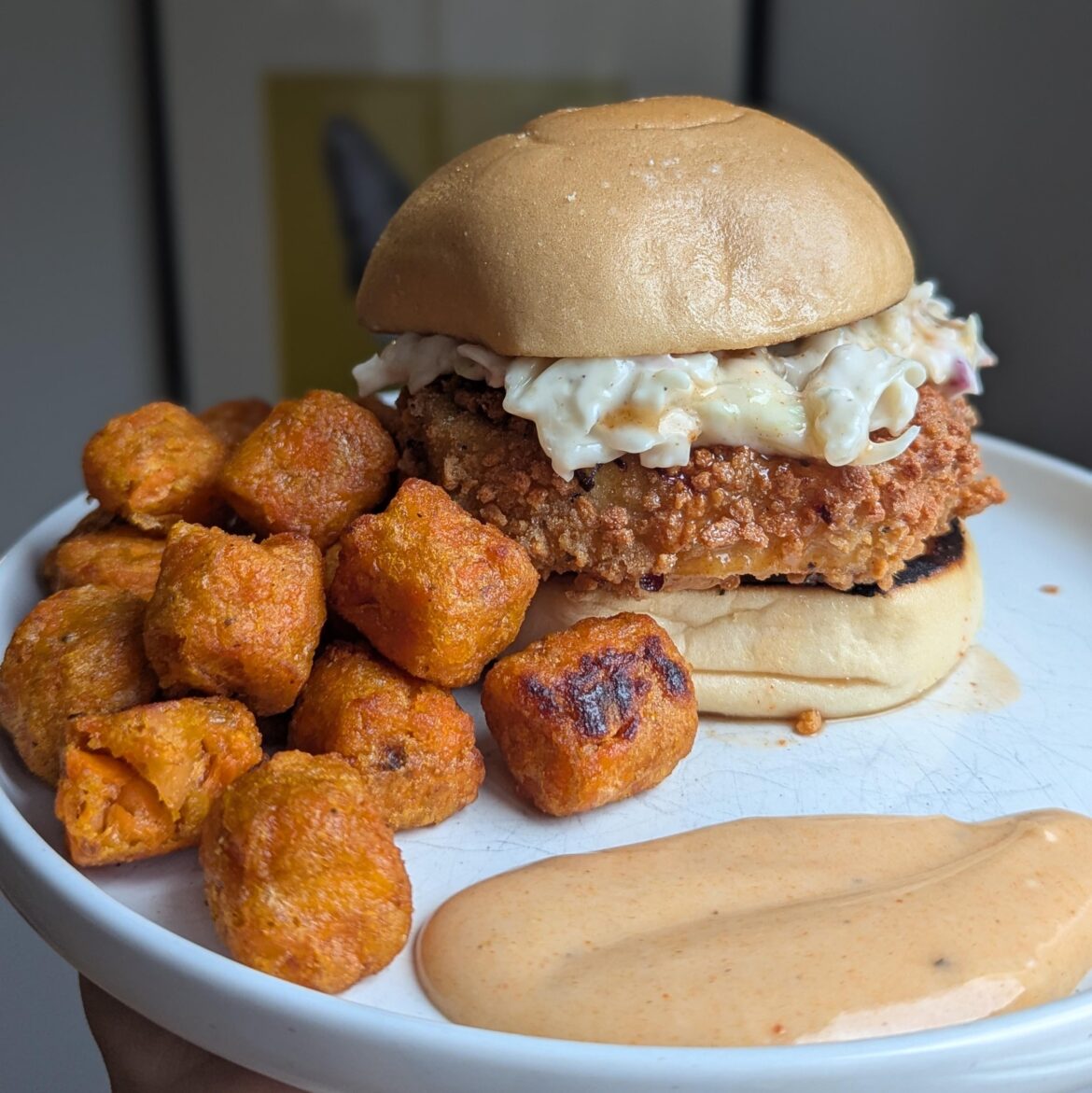 chicken and waffle sandwich with creamy slaw, hot sauce maple syrup, and a side of sweet potato tots with sriracha maple dijonnaise. fucc’d me up.