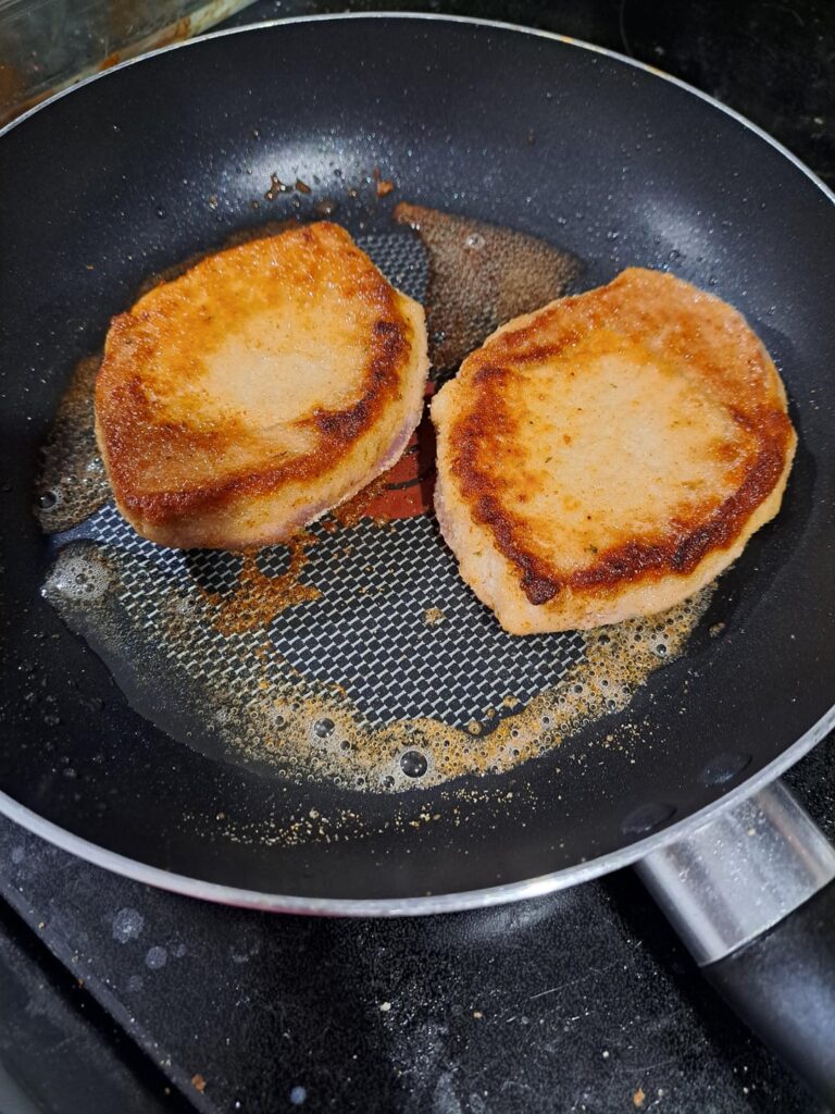 Baked salmon, pork chops and broccoli Alfredo pasta.