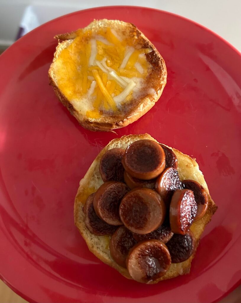 Sliced franks, shredded cheddar, Kings Hawaiian hamburger bun