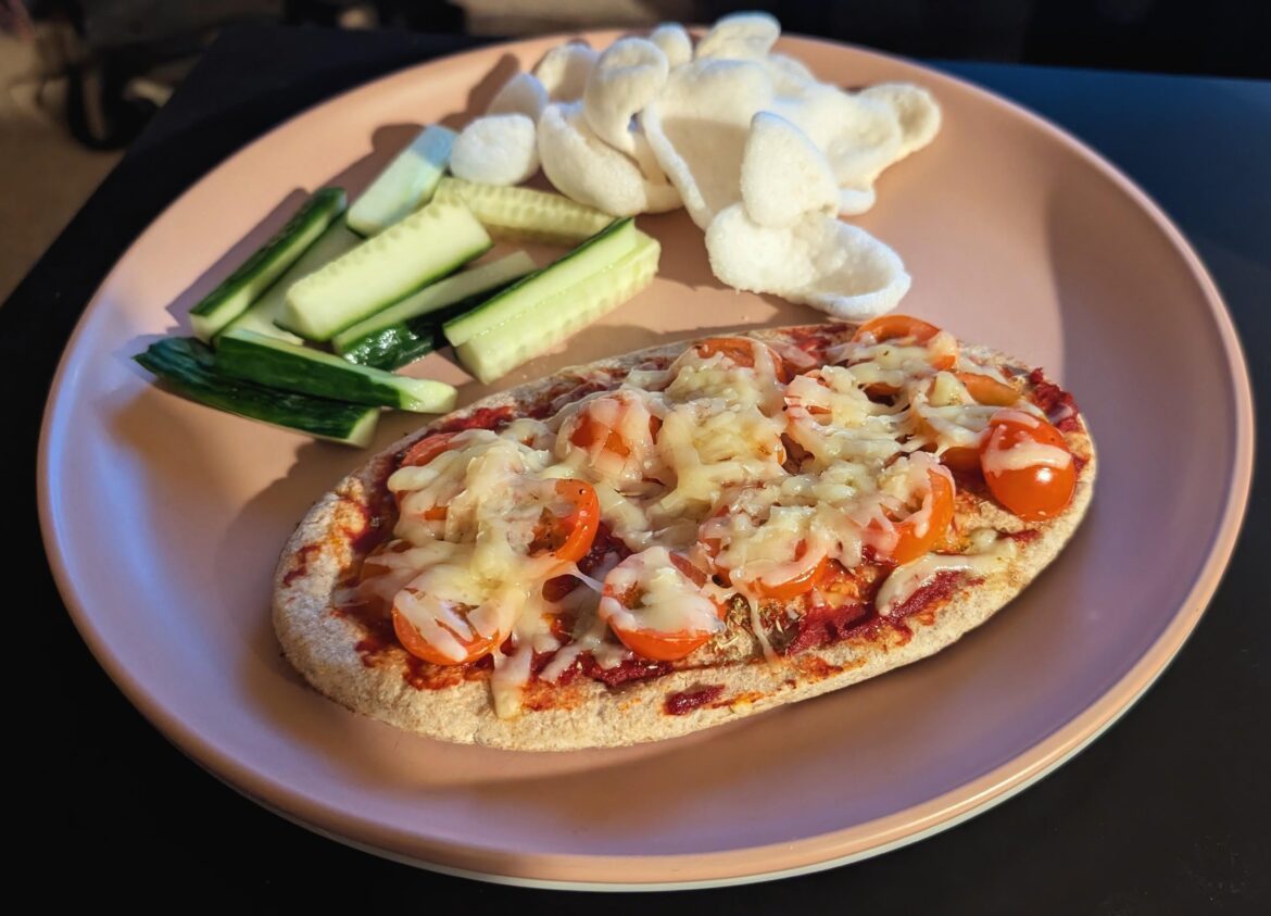 Off away tomorrow so using up bits that won't keep. Here we have a pitta pizza, cucumber sticks and prawn crackers