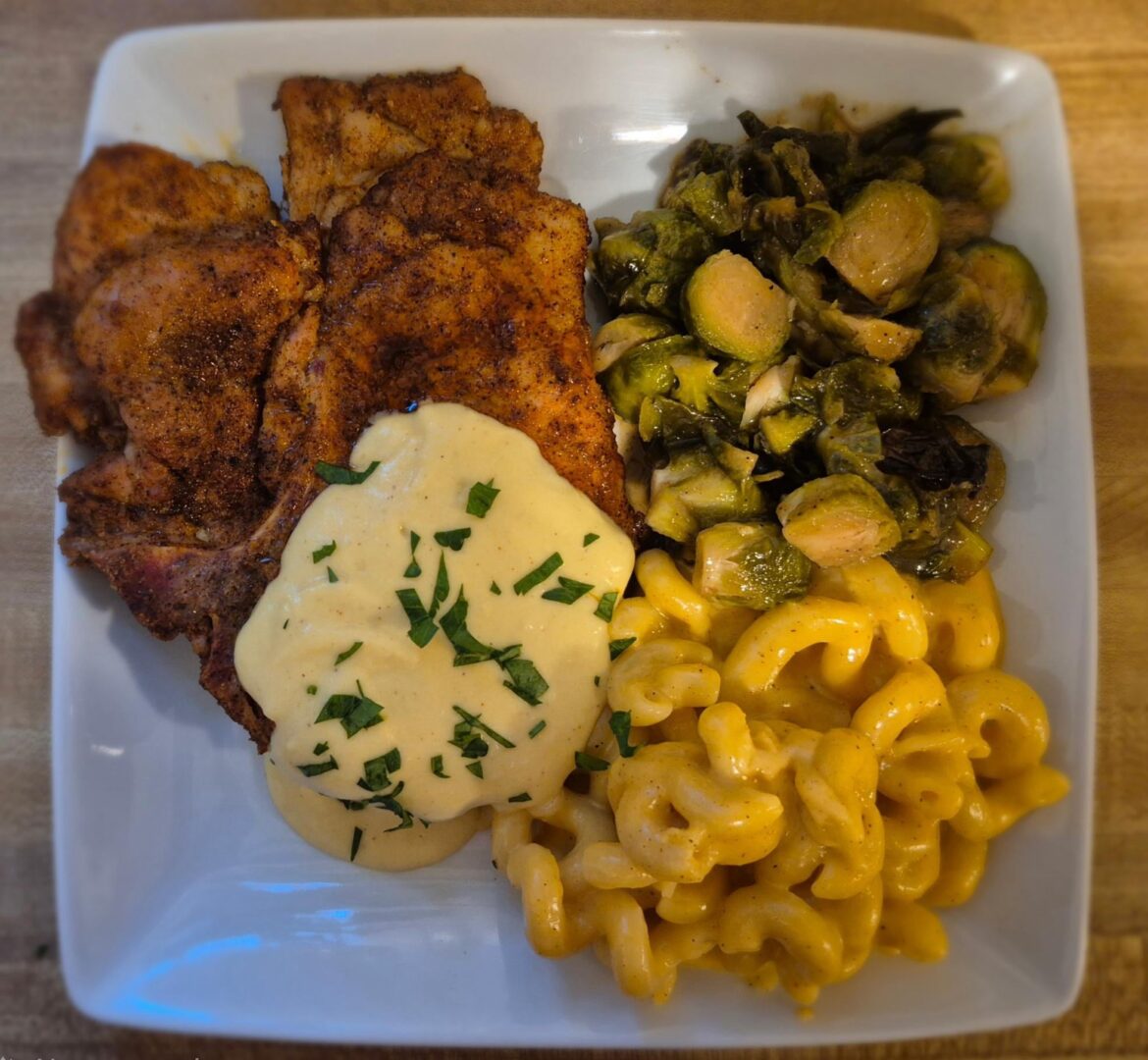 Thin pork loins with a Dijon sauce, honey and balsamic brussel sprouts and mac and cheese
