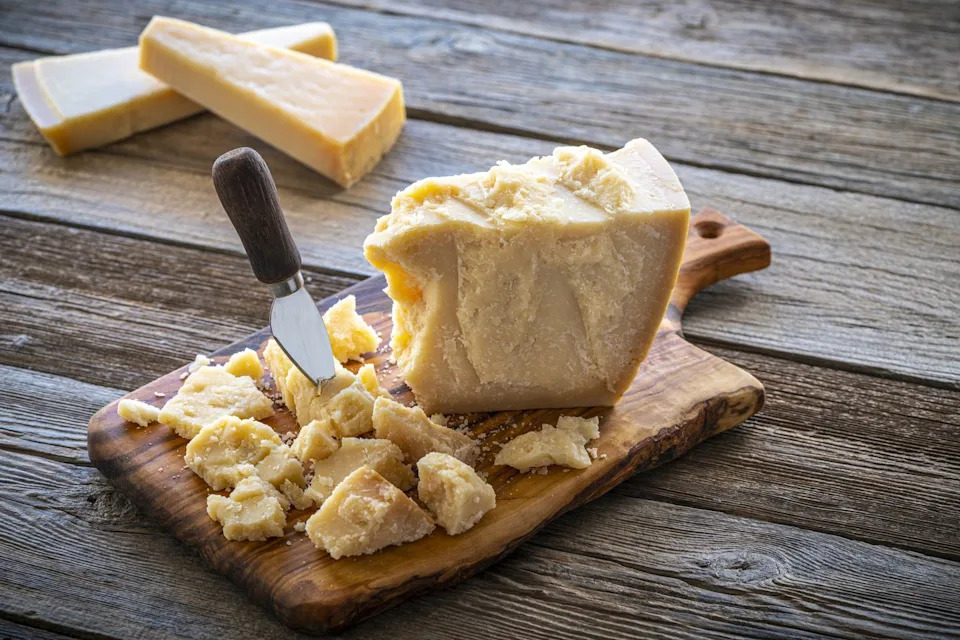 parmesan reggiano cheese on cutting board