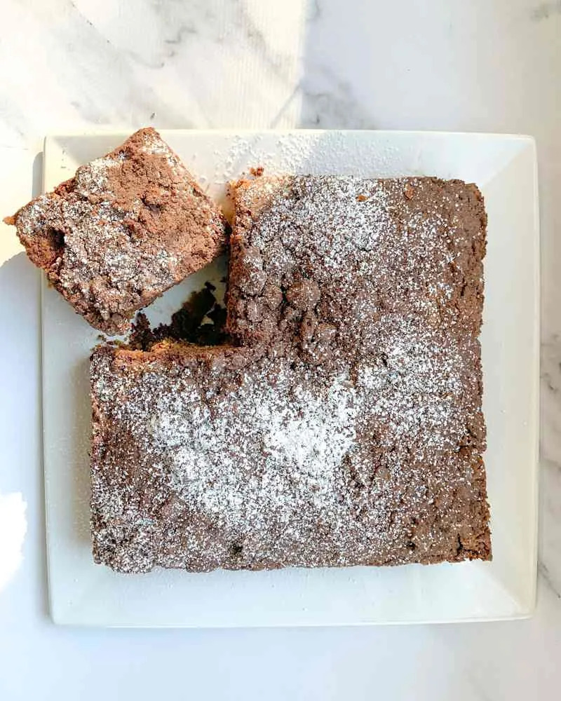 Square of coffee crunch coffee cake next to remainder of cake.