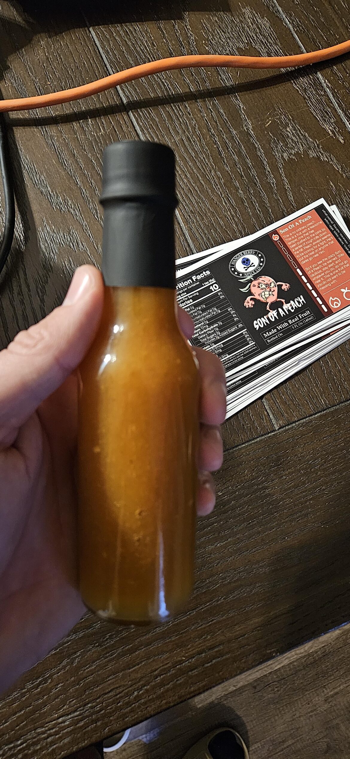 It's a peach cobbler hot sauce. I used habanero, apple cider vinegar, vanilla, cinnamon, nutmeg, ginger and lemon juice. You can literally eat this stuff on ice cream but its surprisingly good on chicken and rice too.