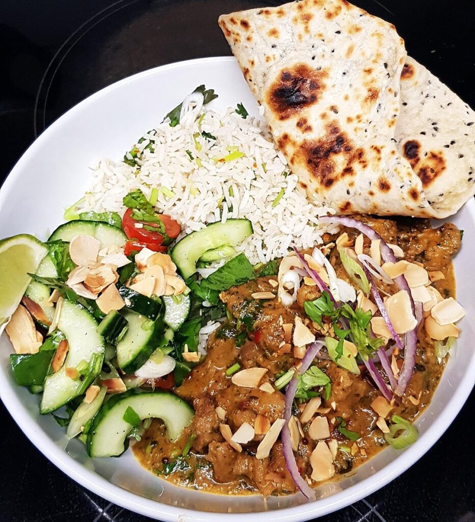 Homemade Pork Pasanda Curry, Lime Coconut Rice, Cucumber Salad and Flatbreads.