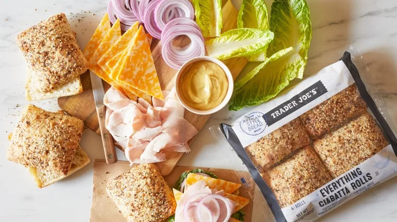 Trader Joe's everything ciabatta rolls with a platter of sandwich toppings