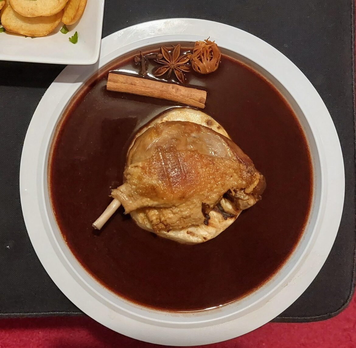 Confit duck with grilled celeriac and a port-winter-spice-sauce.