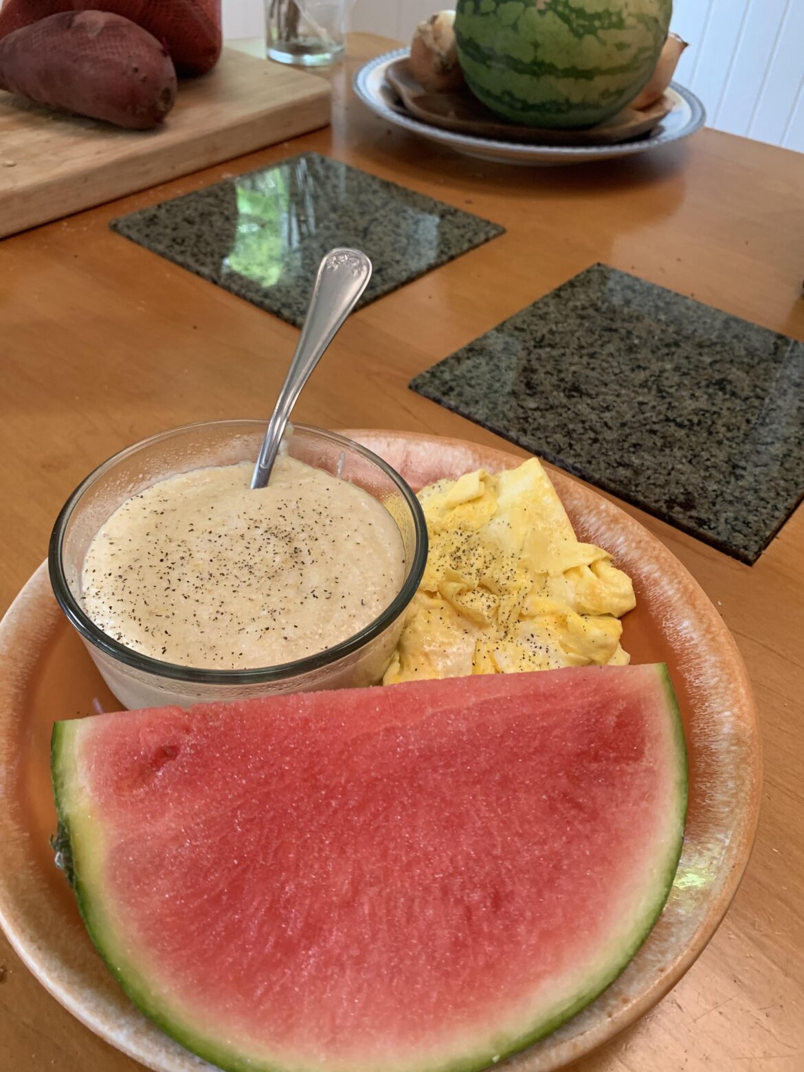 Cheese grits, eggs, and watermelon with salt