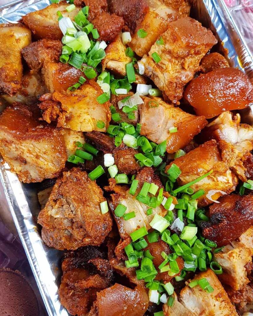 Fried pork with a dash of spring onions - Labone, Ghana