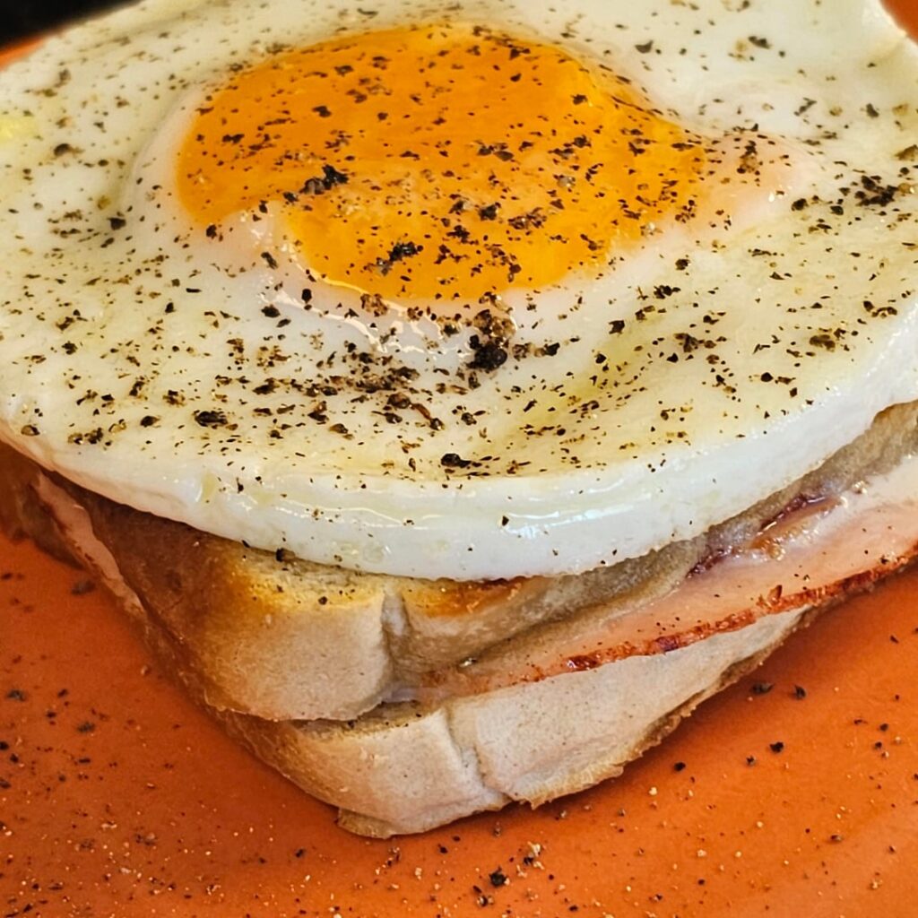 Croque Madame, with boiled ham, Gruyère and fried egg