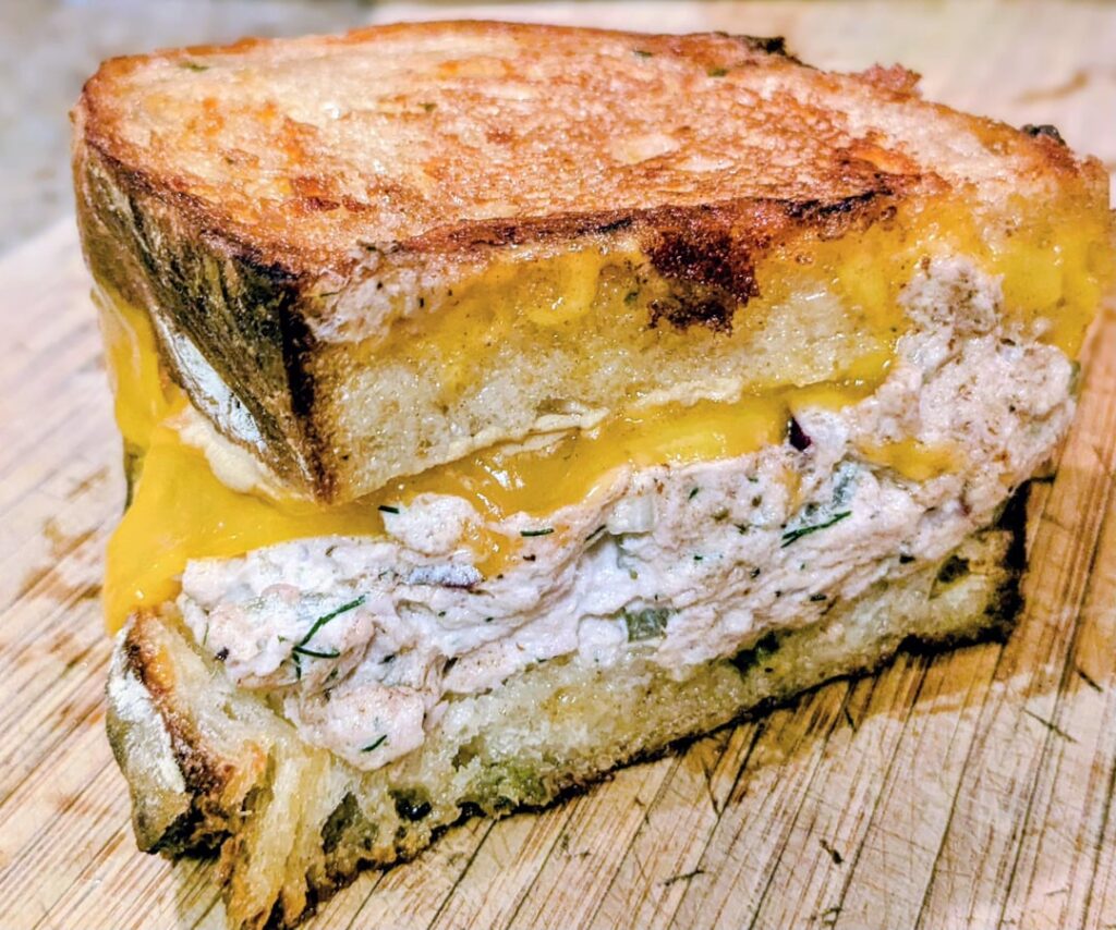 Look at this Cheddar Tuna Melt using my homegrown garlic dill pickles to make Dill Pickle Tuna Salad. Kicker: the bread is my homemade jalapeno-cheddar sourdough; SWIPE for the food porn, recipe link in comments