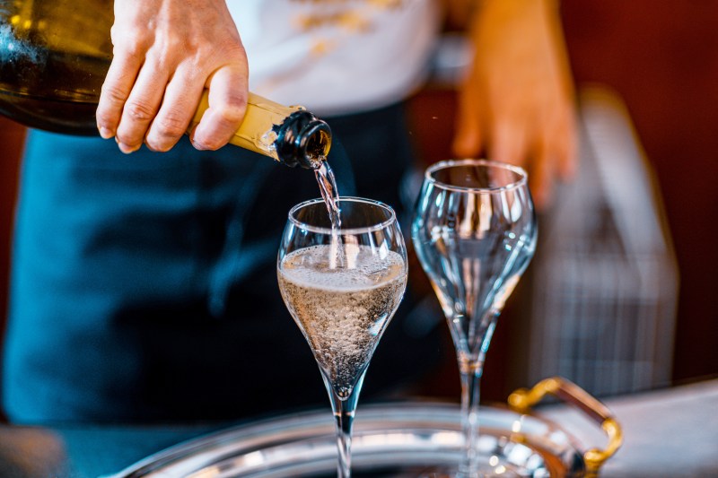 Man pouring Champagne/sparkling wine