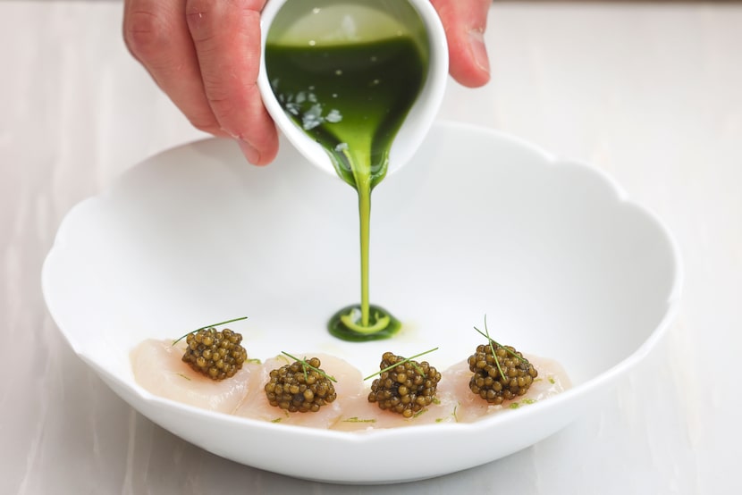 Chef Christophe De Lellis makes a scallop and caviar appetizer at Mamani.