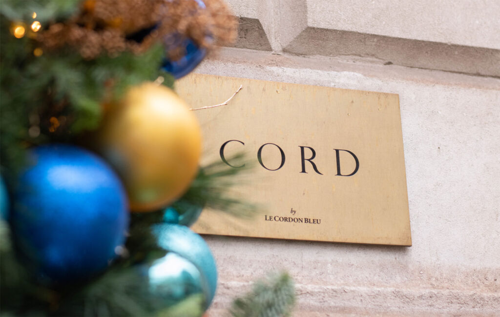 The name sign on the wall of the restaurant