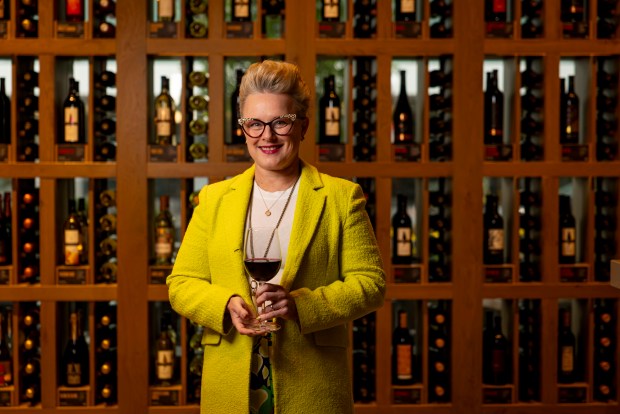 Master sommelier Emily Wines stands in the bar, Oct. 15, 2025, at Cooper's Hawk in Oak Park. (Brian Cassella/Chicago Tribune)
