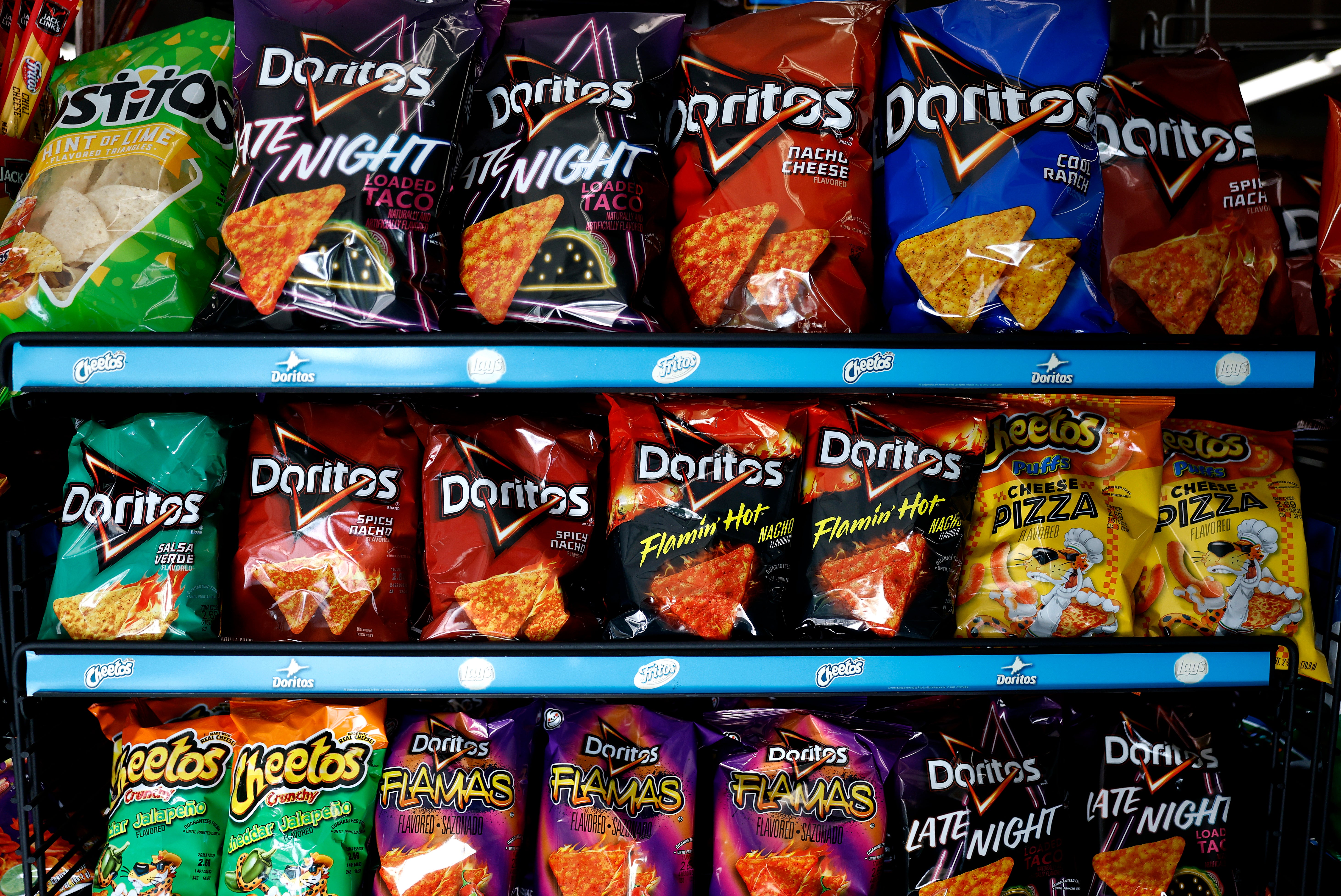 Cheetos and Doritos maker PepsiCo says it plans to implement new recipes for the beloved chips that will not include artificial colors or flavors