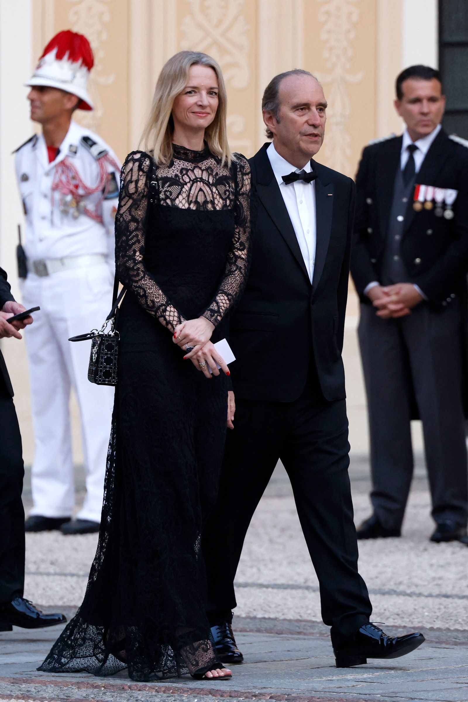 Image may contain Xavier Niel Delphine Arnault Person Clothing Hat Footwear Shoe Accessories Formal Wear and Tie