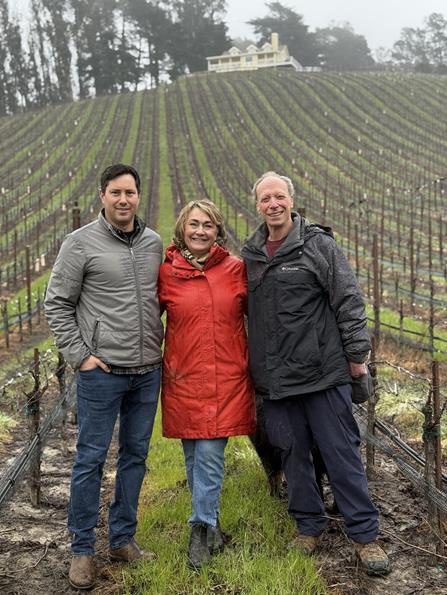 Patrick Nyeholt, Caren Frutig Hatton, and Jeffrey Corpuel stand in the Corpuel Family Vineyard, located in California’s Sebastopol Hills. (Photo courtesy Nestweaver)