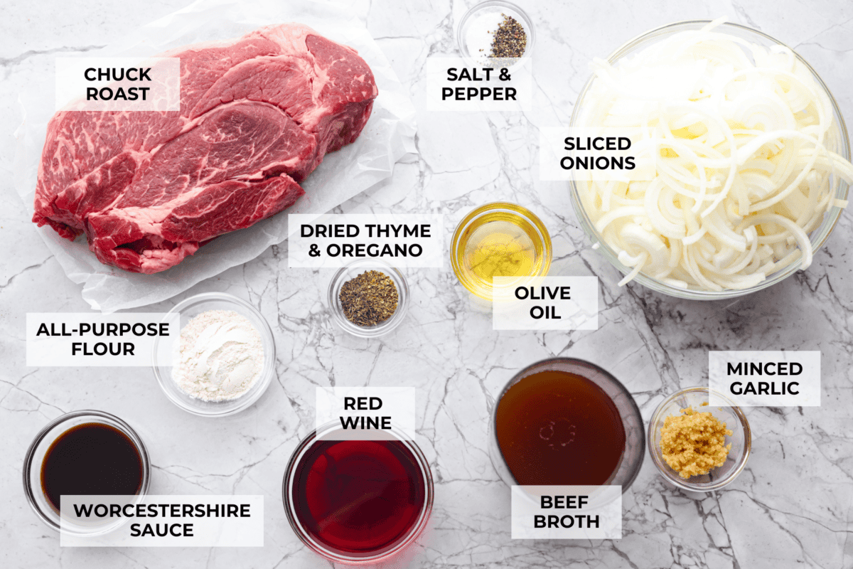 This French Onion Pot Roast is pure comfort food! Slow-cooked to perfection, the roast becomes melt-in-your-mouth tender as it simmers in a rich, savory gravy infused with the deep, caramelized flavor of onions. Overhead shot of labeled ingredients.