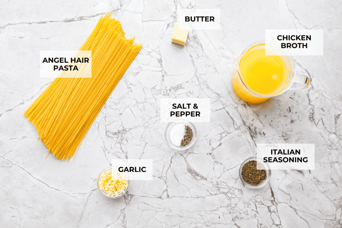 Garlic butter pasta is a quick and simple dish yet packed with flavor. Angel hair pasta is bathed in a buttery garlic sauce and topped with Italian seasoning. Overhead shot of labeled ingredients.