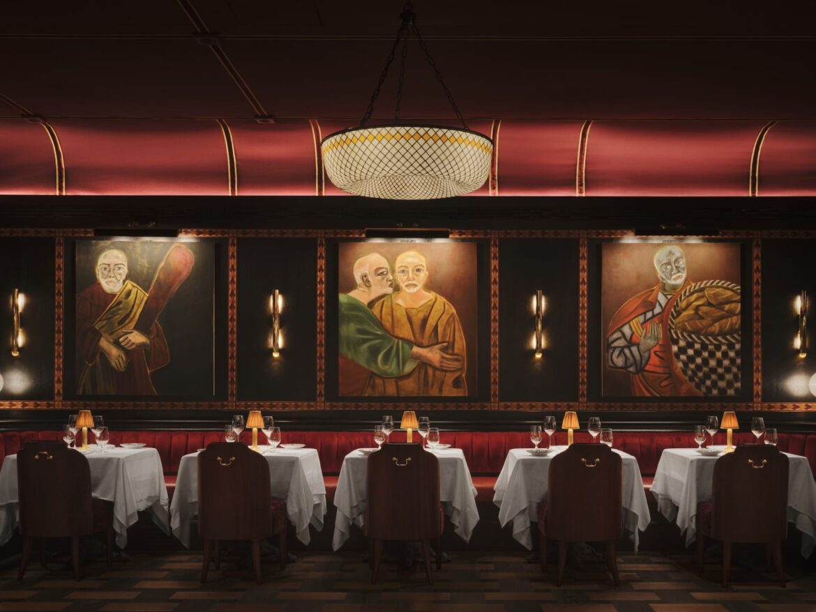 In London, Carbone Stages an Italian Supper-Club Fantasy Dimly lit restaurant with red leather booths, white tablecloths, and art-decorated walls featuring portraits and a chandelier.
