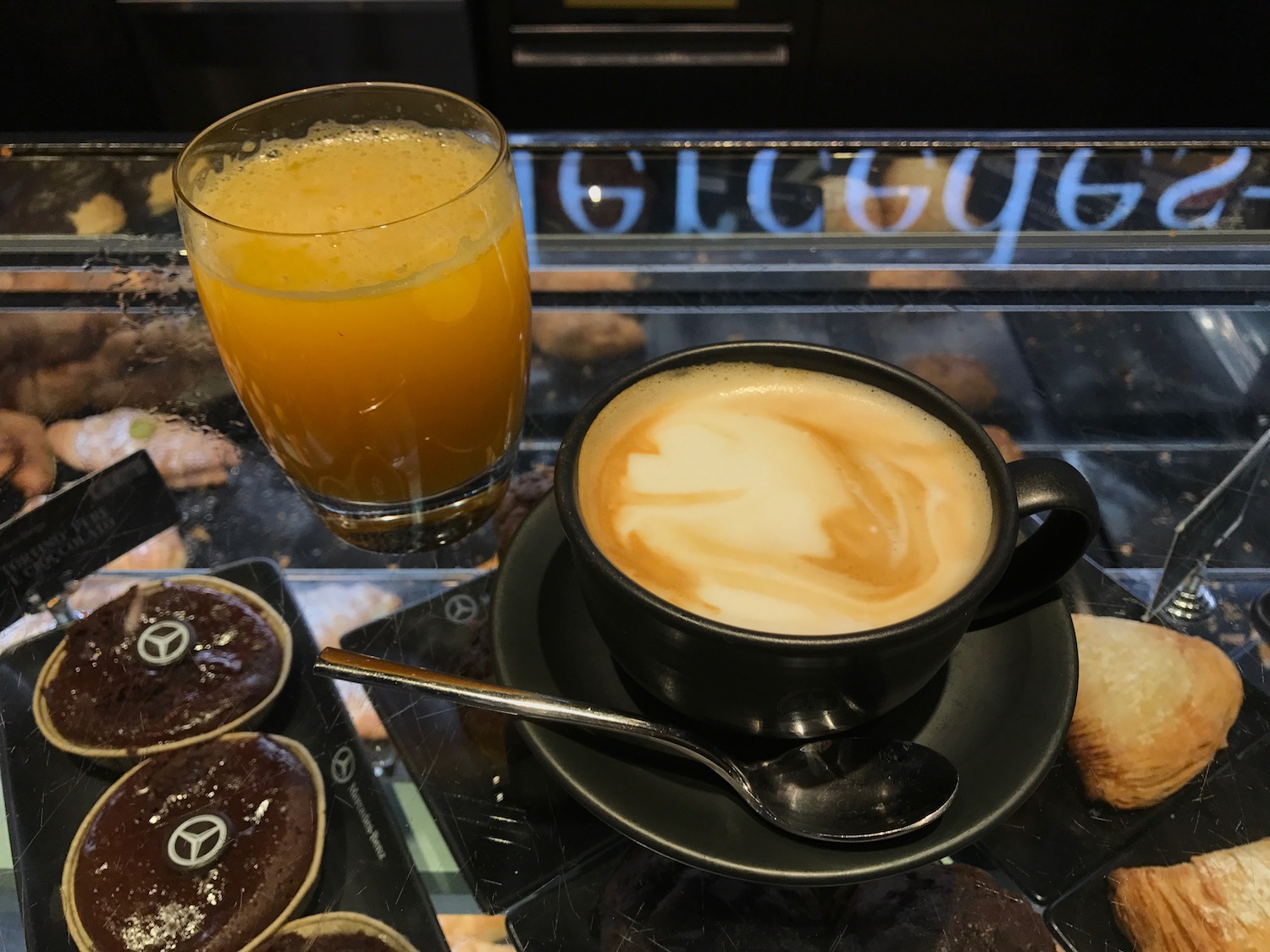 a cup of coffee and a glass of orange juice